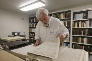 Bob Hirst, the general editor of the Mark Twain Project, with a book of 1866 Sacramento Union newspapers at the Bancroft Library at the University of California at Berkeley. (Jeff Chiu/AP)